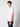 A young man with curly brown hair stands sideways, looking at the camera. He wears a PROJEK RAW Mens Liquid Cotton Short Sleeve T-shirt in plain white and dark pants against a light grey background.