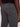 Close-up of a person wearing Projek Raws BASTIEN-GREY pants featuring gray plaid with thin white lines, tailored fit, and visible back pocket. Theyre styled with a black top, and the right hand rests by their side.