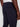 A close-up of someone wearing the Projek Raw ANTOINE-NAVY pants, featuring an elastic waistband and back pocket, set against a plain background.