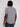 A person with medium-length dreadlocks is seen from the back wearing the Projek Raw BLAISE-BLACK mens shirt and dark jeans against a plain light background.