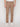 A person wears Projek Raw HUGO-DARK BEIGE jeans in regular fit with white sneakers, standing against a plain white background. The image is cropped to show only the waist down.