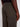A person wearing Projek Raw EDGAR-OLIVE cargo pants and a black shirt, shown from the waist down and viewed from the side and back, with their right hand relaxed by their side.