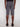 A person faces away from the camera, wearing Projek Raw ISMAËL-GREY knee-length cargo shorts, a black shirt, and black shoes against a plain white background.