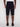 A person stands facing away, wearing Projek Raws JACOBI-NAVY cargo shorts with multiple pockets and black slip-on shoes, set against a plain white background.