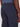 Close-up of a person wearing Projek Raw JAYSON-NAVY pants with an elastic waistband and back welt pockets, featuring part of their dark-skinned hand and a blue shirt tucked in.