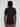 A person with short dreadlocks is seen from behind wearing the Projek Raw ANDRÉ-BLACK short-sleeve collared shirt and brown pants, standing against a plain light gray background.