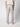 A person is seen from the back wearing PROJEK RAW Men’s Bungee Loose Pant in light gray stretch fabric, paired with a light shirt and white sneakers—an ideal choice for casual everyday style.