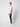 A young man stands in profile against a plain light background, wearing a white t-shirt, PROJEK RAW Men’s Canvas Bungee Pull-on Cargo Jogger, and white sneakers. He looks ahead with a neutral expression.