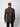 A man, seen from behind against a light background, wears a PROJEK RAW Mens Long Sleeve Casual Dress Shirt in dark brown with black pants, showcasing the shirts easy-care fabric.