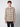 A young man with short curly hair wears the PROJEK RAW Mens Long Sleeve Plaid Button-up Shirt with chest pockets and black pants, standing against a plain light background.
