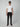 A man in sunglasses and a plain white t-shirt models PROJEK RAW Mens 5-Pocket Solid Bungee Pant, shown facing forward against a light gray background.
