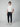 A young man stands in a studio wearing a white short-sleeve shirt, PROJEK RAW MENS CARGO PULL-ON JOGGER, and white sneakers. He faces forward with a neutral look against a plain light gray background.
