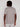 A person with medium brown skin and short dreadlocks is shown from the back, wearing the Projek Raw AARON-GREY short-sleeve shirt and light-colored pants against a plain light background.
