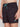 A person wears BRUNO-CHARCOAL swim shorts by Projek Raw, featuring a subtle palm tree pattern, teal drawstring, and a small arrow logo on the left leg, standing against a plain background.