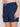 A person wearing Projek Raw BRUNO-NAVY swim trunks, featuring a palm tree pattern and light blue drawstring, shown waist to mid-thigh.