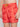 A person wearing Projek Raw BRUNO-PAPAYA swim trunks with a palm tree pattern, red color, and a bright yellow drawstring, shown from waist to mid-thigh.