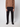A person stands against a plain background wearing a brown long-sleeve sweater, black sneakers, and PROJEK RAW Mens Stretch Bungee Cargo Pant. Their face is not visible.
