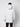 A person in a light gray PROJEK RAW Mens Textured Ripstop Ecofill Quilted Parka with Hood and black pants stands with their back to the camera against a plain white background.