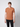 A young man with short light brown hair stands against a plain background, wearing a PROJEK RAW Mens Liquid Cotton Short Sleeve T-shirt in brown and black pants, looking straight at the camera with a neutral expression.