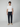 A young man stands facing forward against a plain background, wearing a white t-shirt, PROJEK RAW MENS DRAWSTRING CHINO PANT, and beige slip-on shoes.