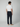 A man faces away, wearing a white tee, beige loafers, and PROJEK RAW MENS DRAWSTRING CHINO PANT in a relaxed fit, set against a plain light background.