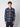 A young man with curly hair faces forward, wearing a PROJEK RAW Mens Plaid Corduroy Long Sleeve Shirt in navy and gray with two chest pockets, against a plain light background.