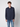 A young man with curly brown hair wears the PROJEK RAW Mens Long Sleeve Casual Dress Shirt in dark navy, featuring two chest pockets, paired with light blue jeans against a plain background. Made from easy-care fabric for everyday style.