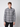 A man wears the PROJEK RAW Mens Long Sleeve Plaid Button-up Shirt with a black pattern, standing facing forward against a plain light gray background.