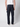 A person is seen from behind wearing PROJEK RAW Mens Colored Denim Carpenter Pants in dark navy, paired with a white shirt and white shoes, highlighting the pants large utility pockets.