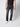 A person wearing a black t-shirt, PROJEK RAW Mens 5-Pocket Straight Fit Jeans, and white sneakers stands against a plain light background. The photo is cropped to show only the body from shoulders down.