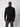 A man faces away from the camera, wearing a PROJEK RAW Mens Long Sleeve Full Zip Mock Neck Sweater in black and dark gray pants, set against a plain light background.