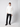A man wears the PROJEK RAW Mens Zip Mock Neck Sweater against a white background, paired with black pants and shoes. He has one hand in his pocket and looks straight ahead with a neutral expression.