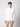 A young man stands facing forward, wearing a PROJEK RAW Mens Zip Mock Neck Sweater and khaki cargo pants against a plain light gray background.
