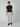 A man faces forward against a plain light gray background, wearing PROJEK RAW Mens Solid Bungee Cargo Pant with an elasticized waistband, a fitted black T-shirt, and black slip-on shoes, exemplifying modern streetwear style.