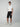 A young man in a white t-shirt, PROJEK RAW MENS CARGO CAPRI SHORT, and white sneakers stands facing forward with a neutral expression against a plain light gray background.