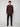 A man stands facing forward against a plain light background, wearing a dark burgundy long-sleeve button-up shirt, PROJEK RAW MENS 5-POCKET SOLID BUNGEE CHINO PANT in black, and matching black shoes.
