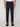 A person wears PROJEK RAW MEN’S RELAXED BUNGEE TWILL CHINO PANT in dark navy, paired with brown lace-up shoes. The photo, cropped from the waist down, features the person standing against a plain white background.