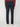 A person stands facing away from the camera, wearing a maroon sweater, PROJEK RAW MENS CANVAS BUNGEE 5-POCKET PANT in navy blue, and white sneakers against a plain light background.
