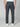 A person wearing PROJEK RAW MENS CANVAS BUNGEE RELAXED CARGO PANT in dark gray with white sneakers, seen from the back against a plain light gray background.