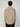 A person with curly brown hair is seen from behind, wearing the PROJEK RAW MENS LONG SLEEVES CORDUROY SHIRT in light beige with black buttons and black pants, set against a plain light background.