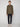 A man faces forward against a plain background, wearing a PROJEK RAW MENS LONG SLEEVES KNIT FLANNEL SHIRT in olive green, paired with dark navy pants and white sneakers.