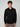 A man with short curly hair wears a black PROJEK RAW MENS LONG SLEEVE FAUX SUEDE OVERSHIRT with front zippers, standing against a plain light background.