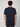 A person with short, curly brown hair faces away from the camera, modeling a PROJEK RAW MENS SHORT SLEEVE CREW NECK T-SHIRT in navy blue and dark pants against a plain light gray background—a great choice for any casual look.