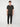 A young man faces forward against a plain white background, wearing the PROJEK RAW MENS SHORT SLEEVE CREW NECK T-SHIRT, black joggers, and white sneakers—an essential casual wardrobe look.