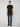A person stands facing forward against a plain light background, wearing a black short-sleeve t-shirt, PROJEK RAW MENS BARU STRAIGHT FIT JEAN in stretch slub denim, and black shoes.