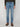 A person wears the PROJEK RAW MENS BARU STRAIGHT FIT STRETCH JEAN in light blue, styled with a dark sweater and brown boots. The lower half is shown against a white background, highlighting a classic Projek Raw look.