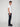A young man with curly hair stands in profile against a plain light background, wearing a fitted white t-shirt, black sneakers, and PROJEK RAW MENS BARU STRAIGHT FIT COLORED DENIM JEANS.
