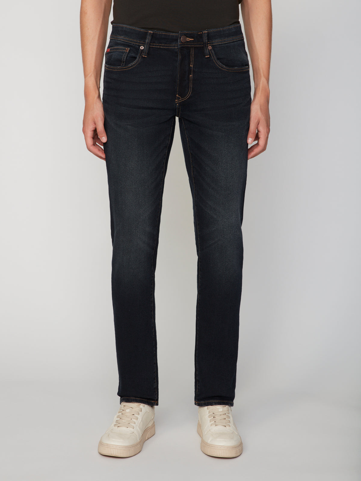 A model wears the PROJEK RAW MEN’S STRETCH SLUB DENIM BARU STRAIGHT FIT PANT with white sneakers, standing against a plain light background. The image is cropped from shoulders down, hands relaxed at sides.
