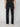 A person wearing PROJEK RAW MEN’S STRETCH SLUB DENIM BARU STRAIGHT FIT PANT in dark blue and white shoes stands facing away, highlighting the back pockets and a brown waistband patch.