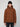 A man in the PROJEK RAW MENS PUFFER JACKET WITH HOOD and a black beanie stands before a light gray backdrop, showcasing lightweight warmth ideal for chilly days.